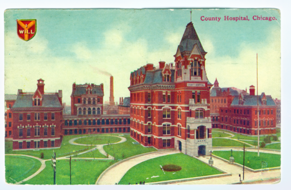 A historical red brick Queen Anne style building complex.