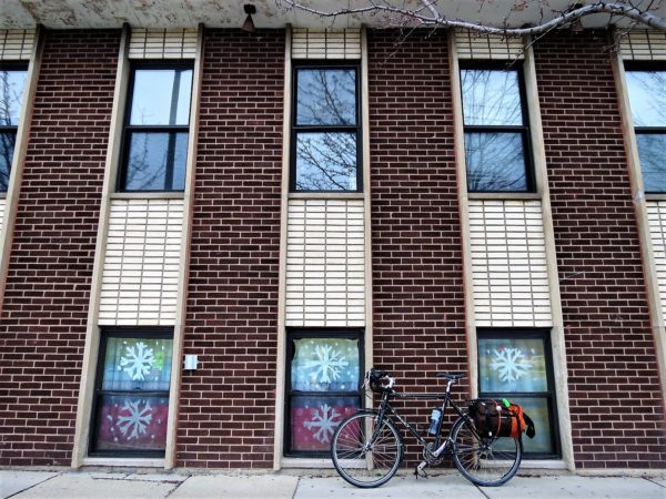 Close up of mid-century modern building brick wall with a tour bicycle in front.