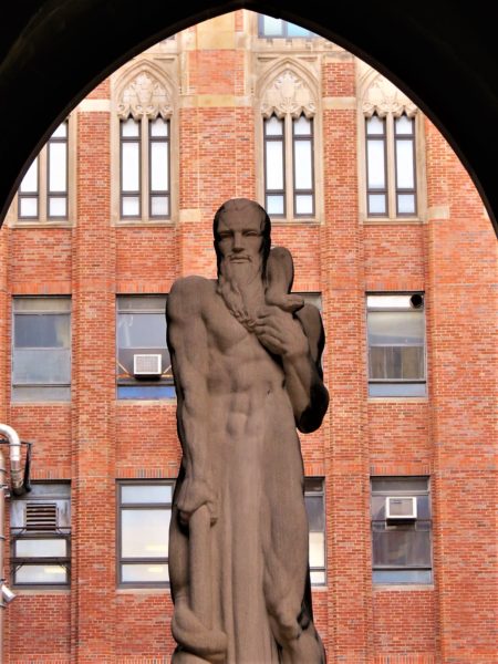 Art sculpture with brick building backdrop