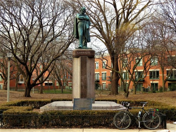 Garibaldi statue in a park with a bicycle during a tour ride.