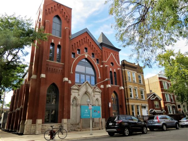 Former church now condos with a bike during a tour ride.