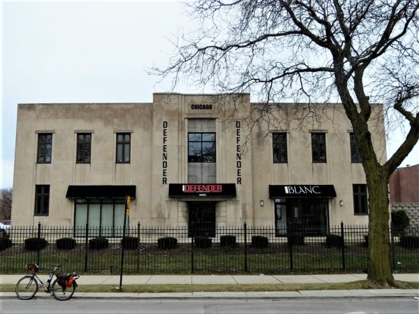 Art deco building facade with a bike during a tour ride.