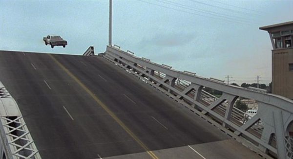 The Blues Brothers movie still of the Bluesmobile jumping a raising bridge