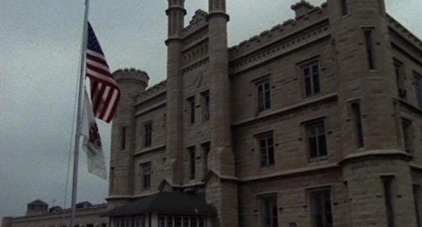 A Blues Brothers movie still of the yellow limestone Gothic Revival Joliet Prison