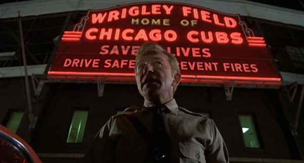 A Blues Brothers movie still of the Nazi leader standing in front of the iconic Wrigley Field sign