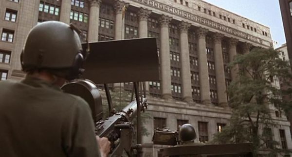 A Blues Brothers movie still of a soldier manning a tank hatch machine gun.