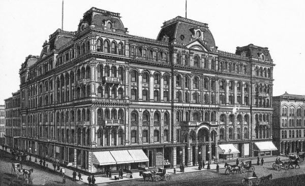 A historical black and white drawing of a massive six story Second Empire style hotel