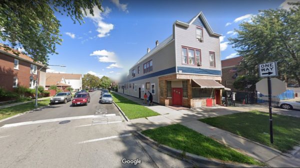 A still from Google Maps showing a wood two story with 1st floor stone faced corner former tavern entrance
