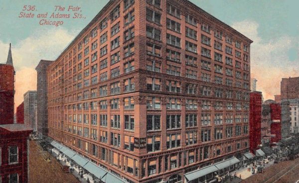 A historic postcard of an eleven story Chicago School corner 1890s building