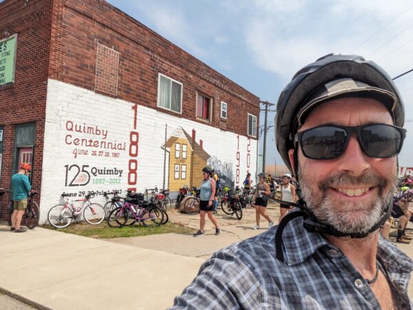 Me and a mural celebrating the 125 years of Quimby