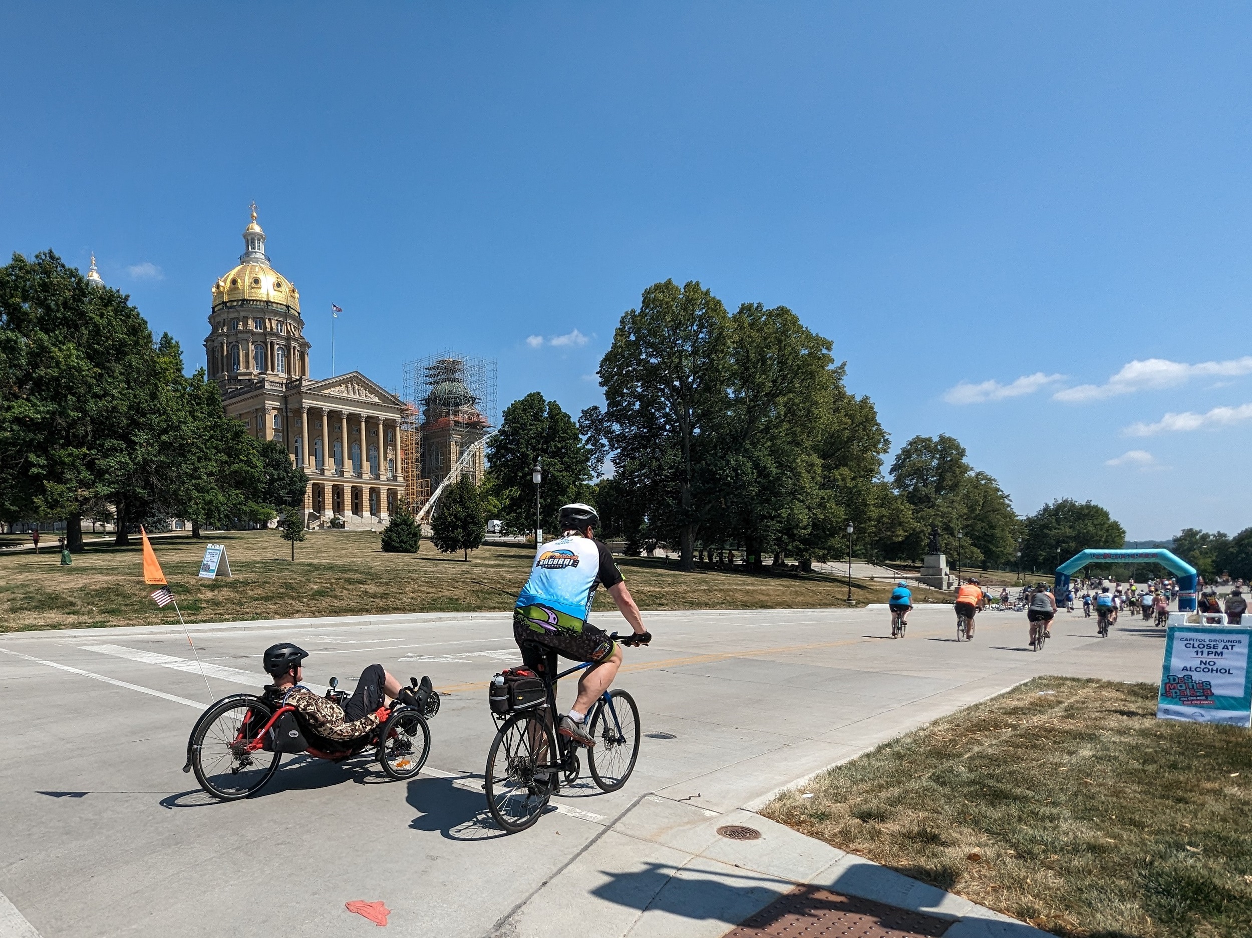 A recumbent tricycle passing the Iowa state capitol building