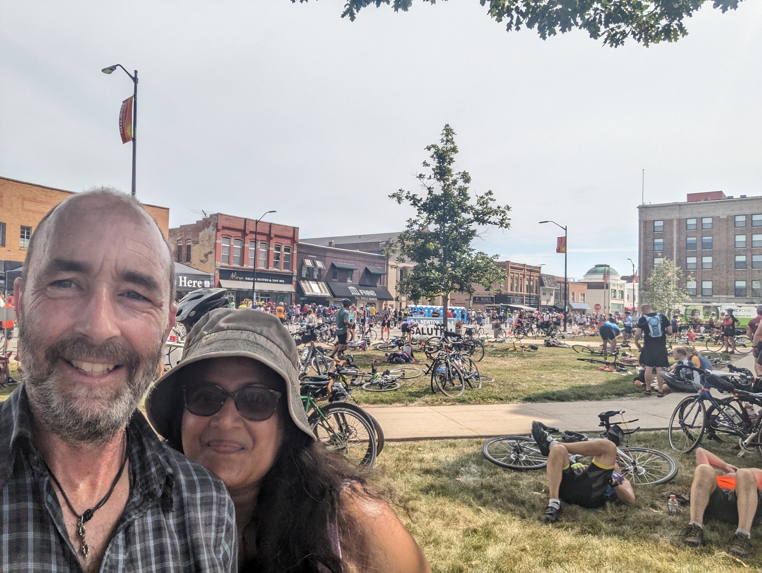 Me and Nitys with late 19th century town square buildings behind.