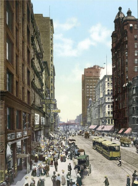 A tinted vintage postcard of the busy State Street in 1890s Chicago.